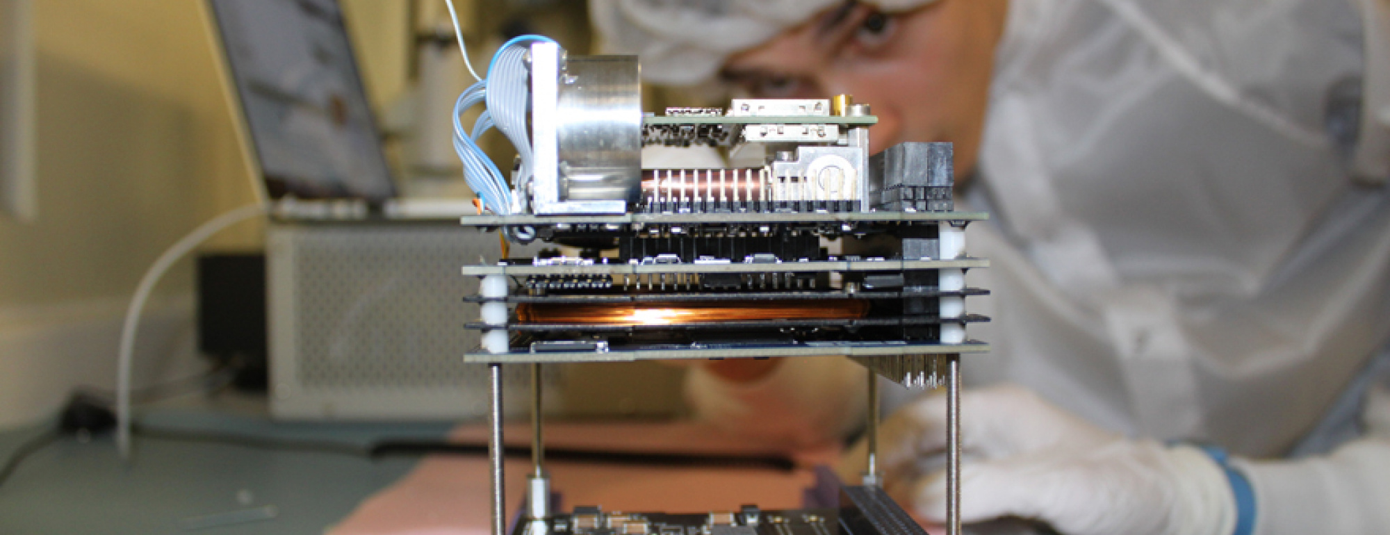 2015-10-10 - Stefan Damkjar, electrical engineering student at the University of Alberta, building the CubeSat Ex-Alta 1 as part of the university’s participation in the QB50 mission. (Credits: University of Alberta, Charles Nokes)